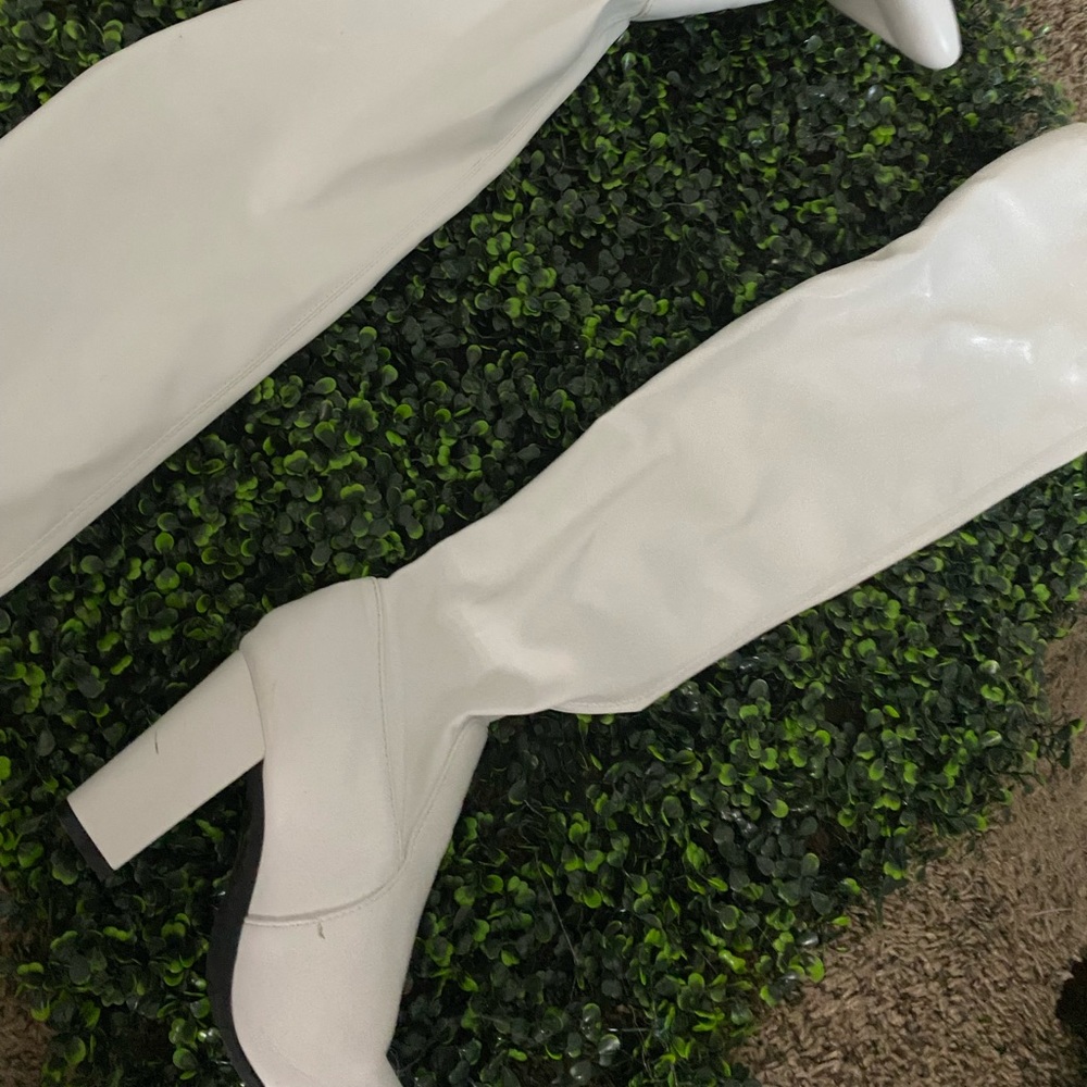 I am selling these white knee high boots